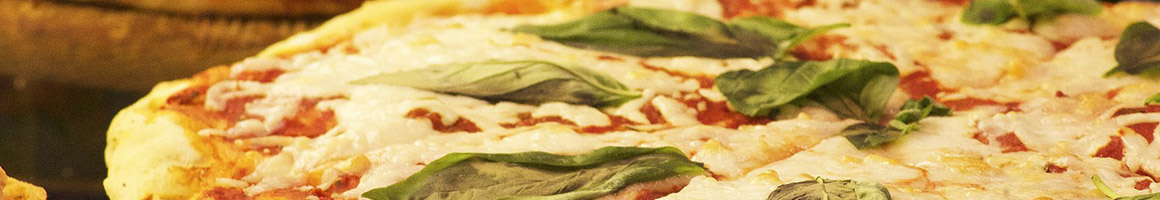 Eating Italian Mediterranean Pizza at Vancosta's Pizza restaurant in Hampton, VA.